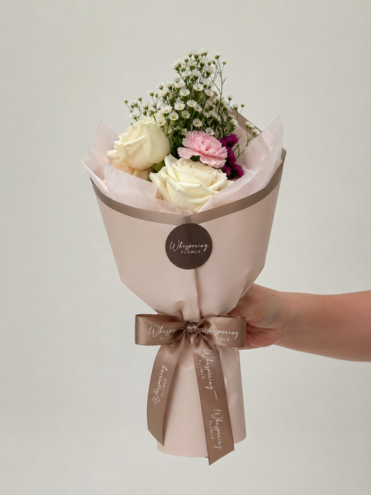 Madi's Posy Mother's Day bouquet — white roses, pink carnations, and burgundy blooms designed by 12-year-old Madi at Whispering Flower, Mount Wellington Auckland.